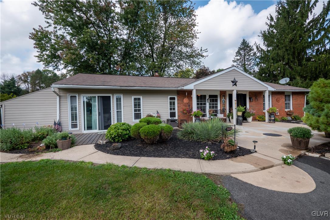 130 County Line Road Riegelsville, PA 18077 - Photo 2 of 40 a front view of a house with a garden