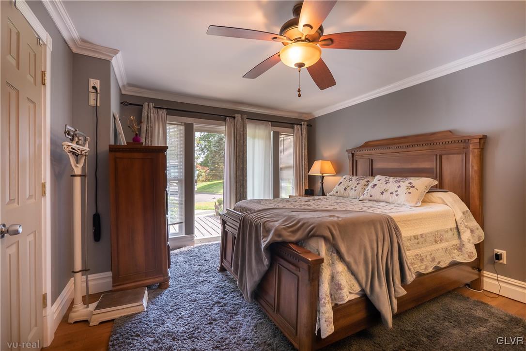 130 County Line Road Riegelsville, PA 18077 - Photo 23 of 40 a bedroom with a large bed chandelier and a window
