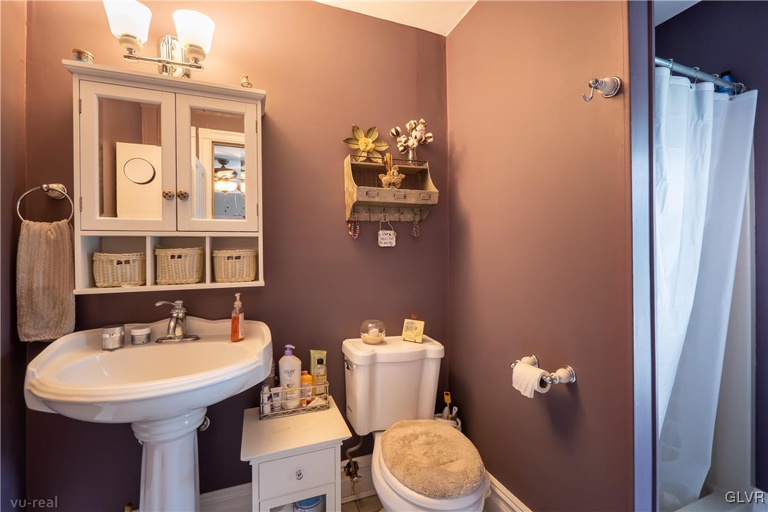 130 County Line Road Riegelsville, PA 18077 - Photo 24 of 40 a bathroom with a sink mirror and toilet