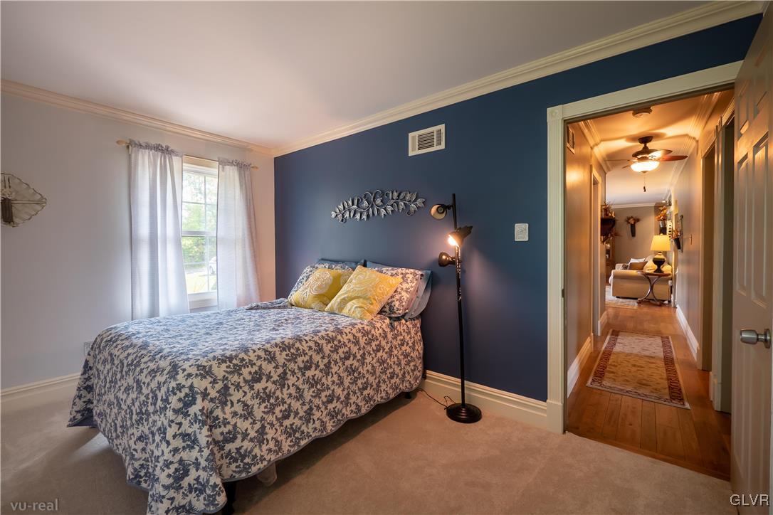 130 County Line Road Riegelsville, PA 18077 - Photo 25 of 40 a bedroom with a bed and a lamp