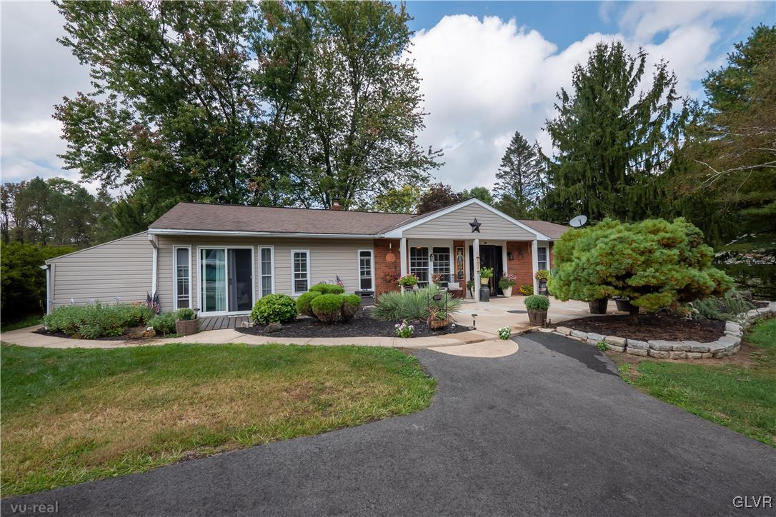 130 County Line Road Riegelsville, PA 18077 - Photo 4 of 40 a front view of a house with a yard and porch