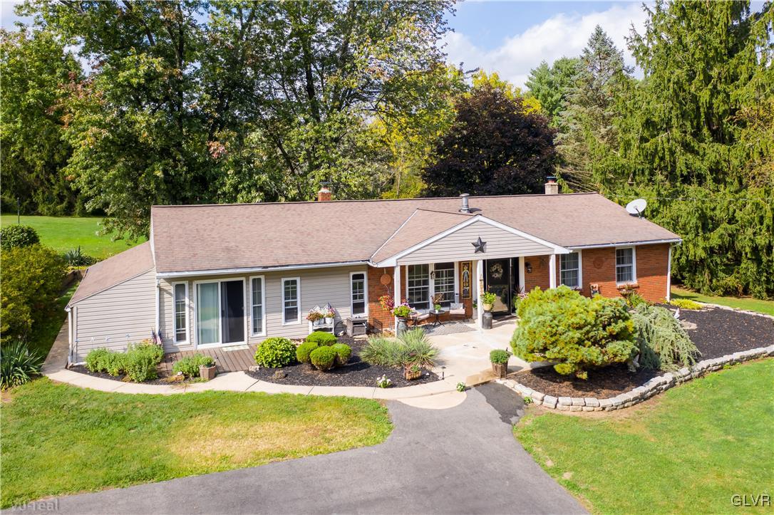 130 County Line Road Riegelsville, PA 18077 - Photo 5 of 40 a front view of a house with a garden