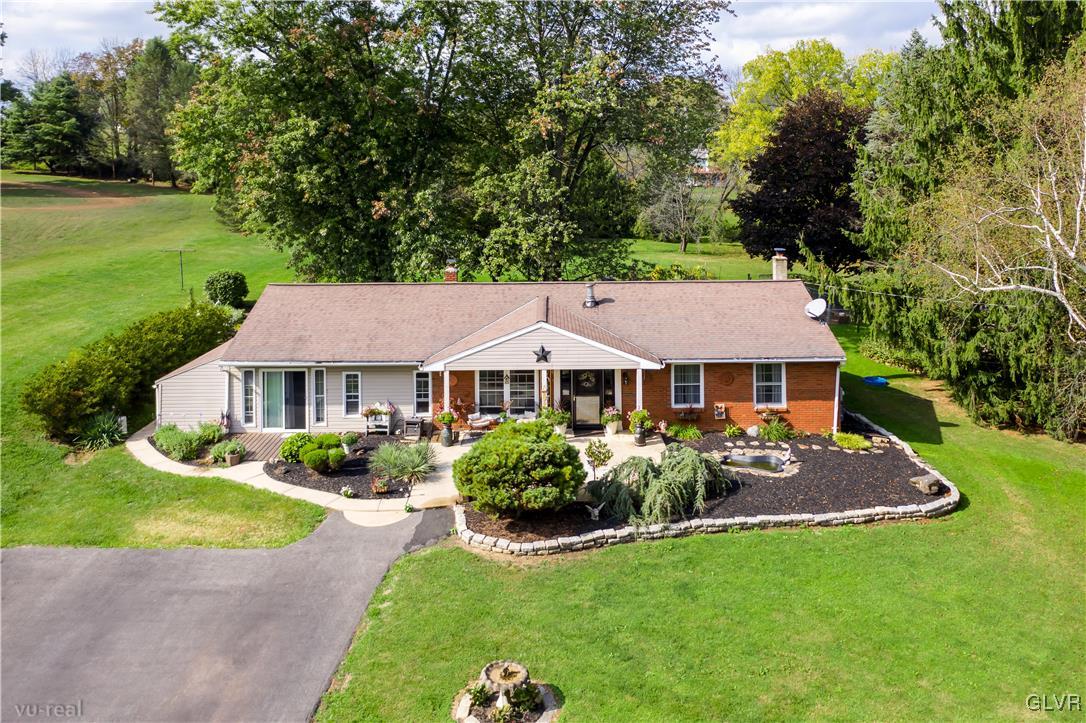 130 County Line Road Riegelsville, PA 18077 - Photo 6 of 40 a front view of a house with a garden