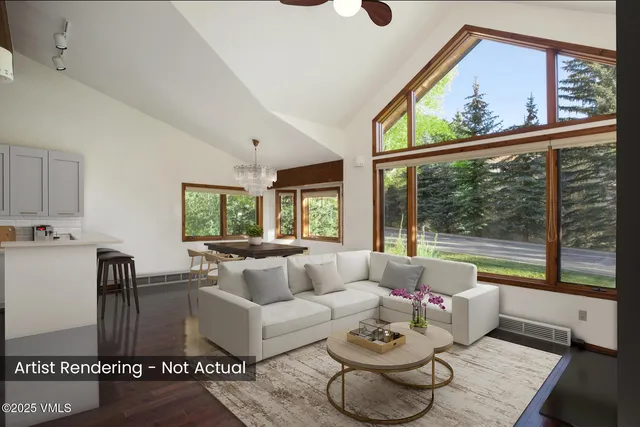 a kitchen with stainless steel appliances white cabinets and wooden floor