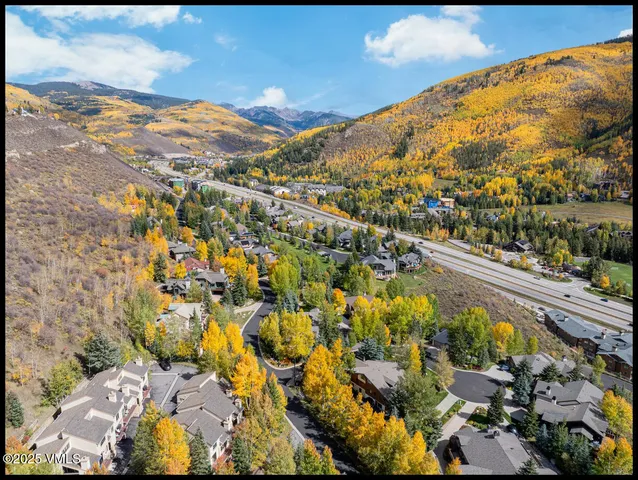 a view of a house with a yard and garage