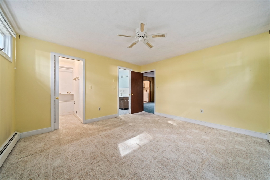 34 Birchcroft Road Canton, MA 02021 - Photo 14 of 31 an empty room with a ceiling fan and a window