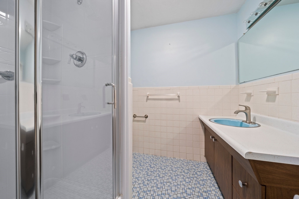 34 Birchcroft Road Canton, MA 02021 - Photo 15 of 31 a bathroom with a sink a toilet and shower