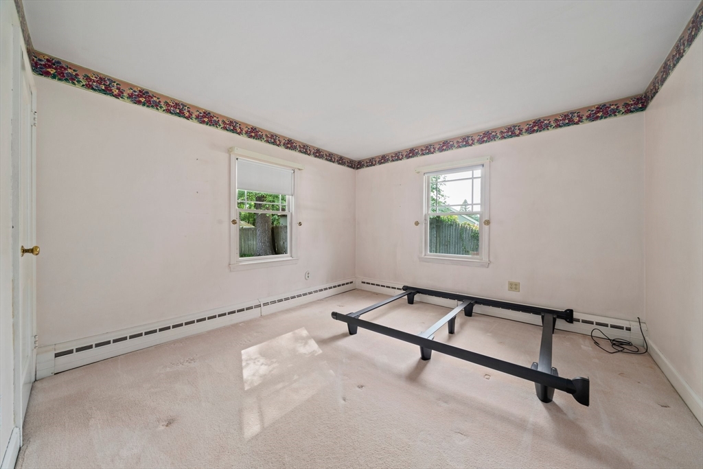 34 Birchcroft Road Canton, MA 02021 - Photo 20 of 31 a view of a room with gym equipment and a window