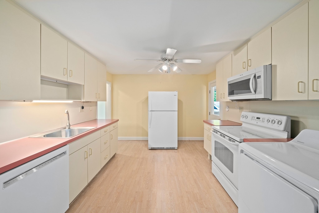 34 Birchcroft Road Canton, MA 02021 - Photo 9 of 31 a kitchen with a sink a stove and cabinets