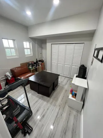 a living room with furniture and a window