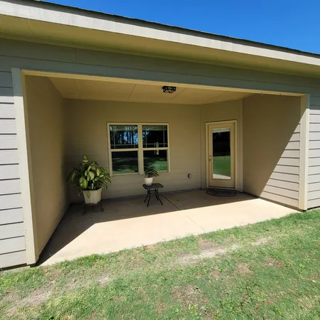 a house view with a backyard space