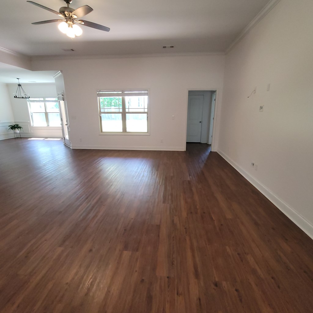 19 Fast Lane Seale, AL 36875 - Photo 3 of 18 an empty room with wooden floor and windows