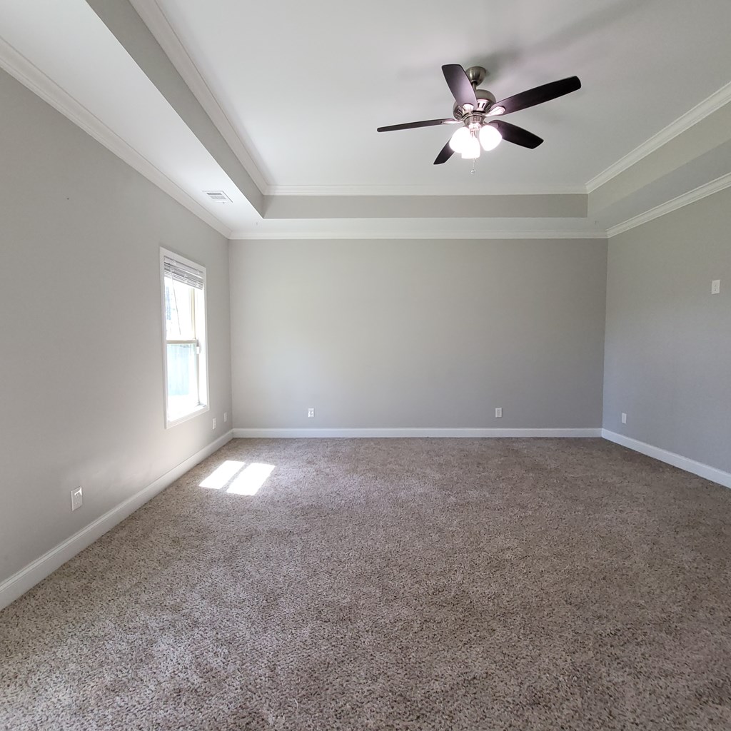 19 Fast Lane Seale, AL 36875 - Photo 8 of 18 an empty room with a window and a ceiling fan
