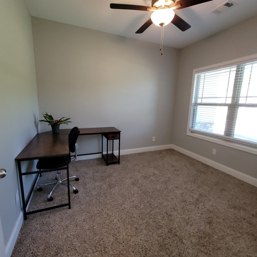 19 Fast Lane Seale, AL 36875 - Photo 10 of 18 an empty room with windows and ceiling fan
