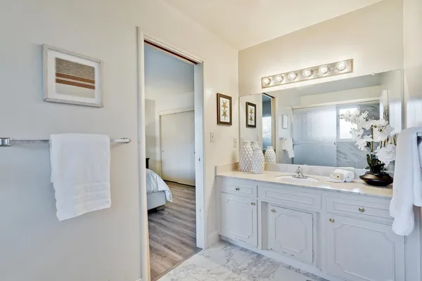 a view of an empty room and wooden floor