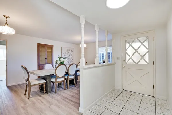 a kitchen with a stove and white cabinets