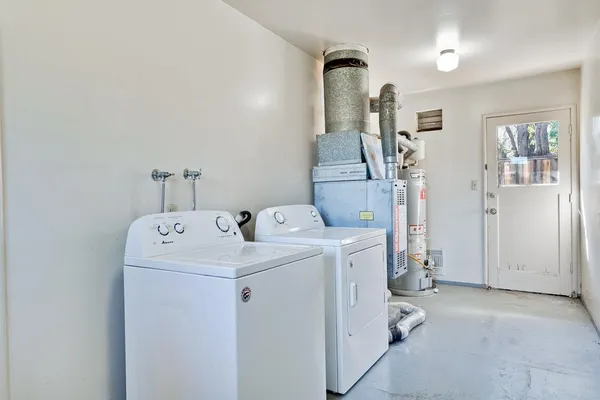 a kitchen with stainless steel appliances a refrigerator sink and cabinets