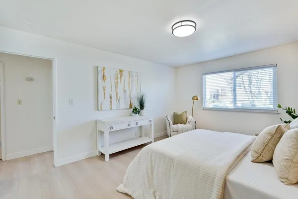 a front view of a house with yard and green space