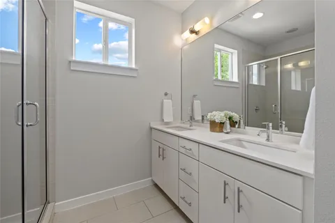a bathroom with a granite countertop sink a mirror and a