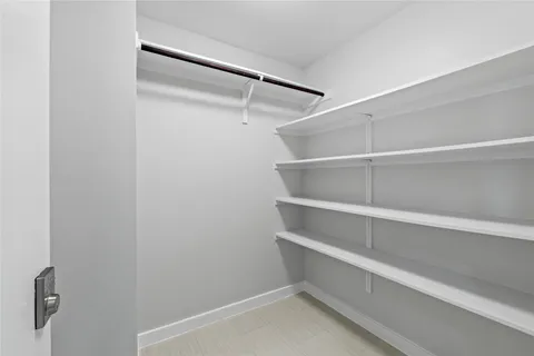 a view of an empty walk in closet