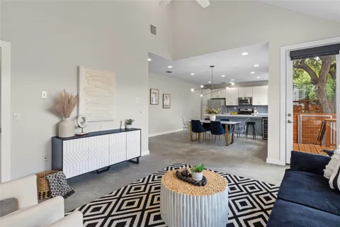 a living room with furniture and a table