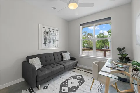 a living room with furniture and a window