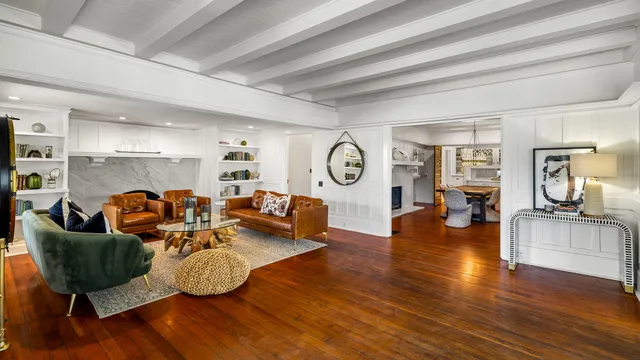 a bathroom with a granite countertop sink a mirror and a shower