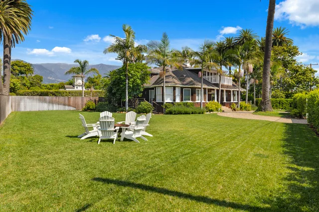 a view of a house with a yard porch and sitting area