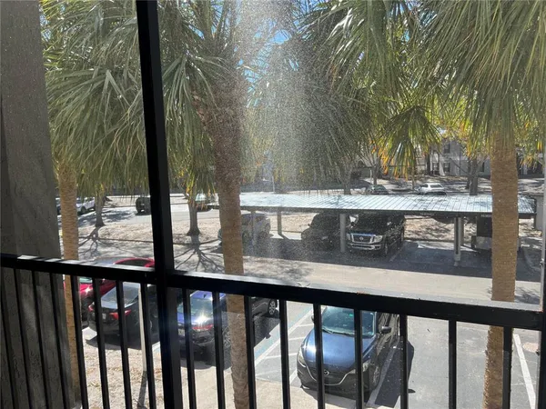 a view of a balcony with wooden floor