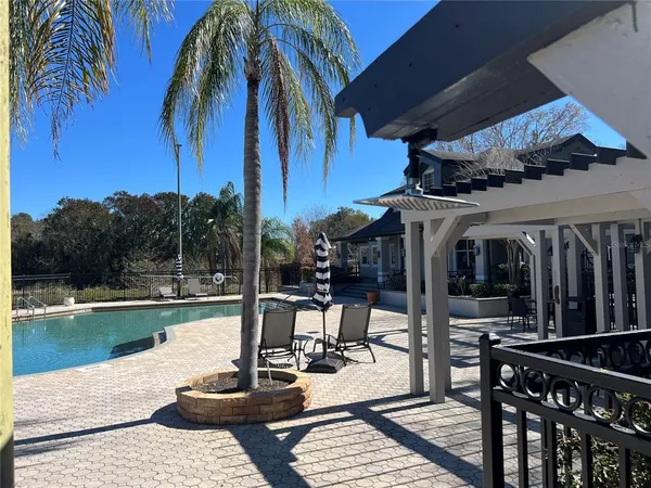 a view of a patio with swimming pool