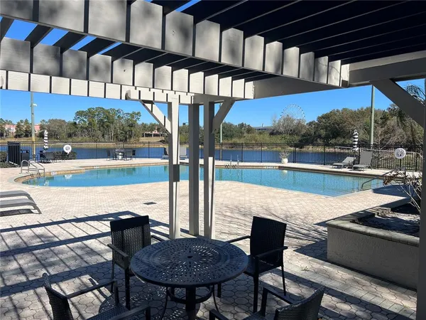 a view of a swimming pool with a patio