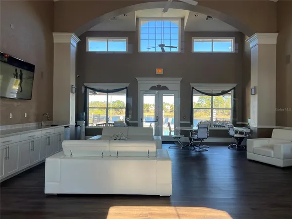 a living room with fireplace furniture and a flat screen tv