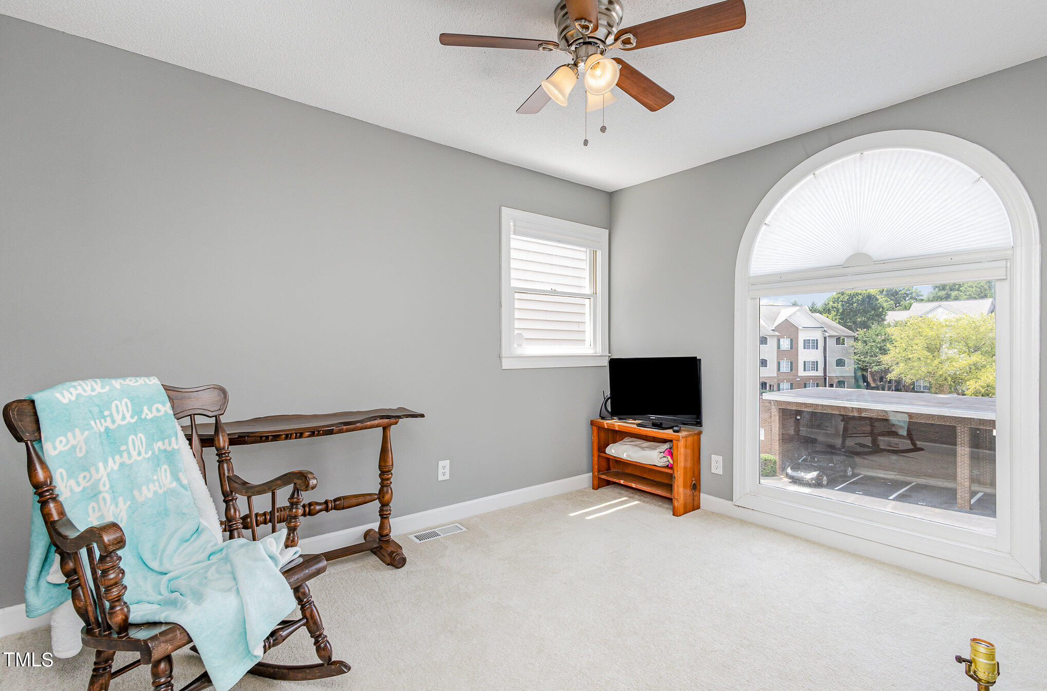 7040 Sandy Forks Road, Unit 203 Raleigh, NC 27615 - Photo 25 of 30 a view of a livingroom with furniture and a flat screen tv