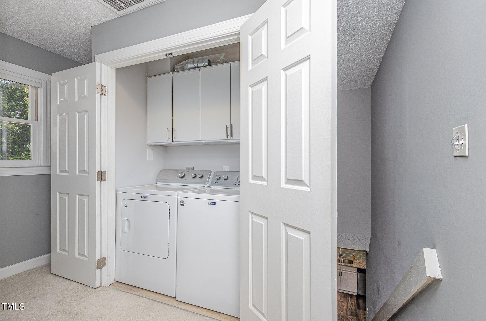 7040 Sandy Forks Road, Unit 203 Raleigh, NC 27615 - Photo 28 of 30 a view of cabinets and window