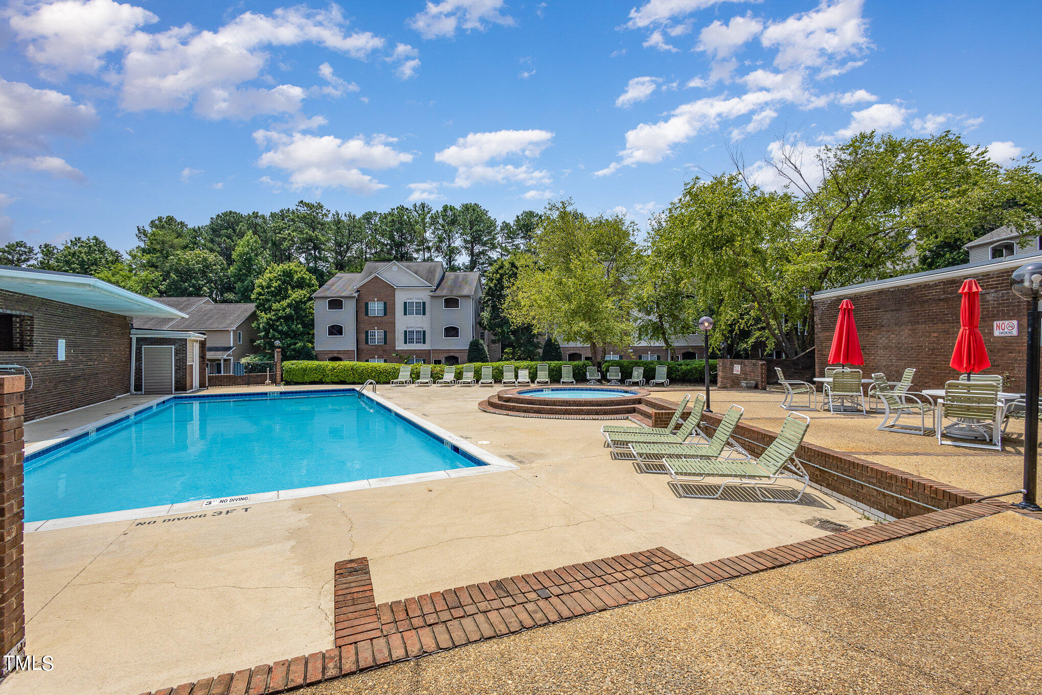 7040 Sandy Forks Road, Unit 203 Raleigh, NC 27615 - Photo 30 of 30 a view of a swimming pool with a patio and a yard