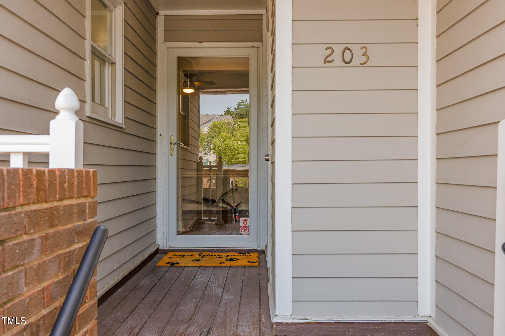 7040 Sandy Forks Road, Unit 203 Raleigh, NC 27615 - Photo 5 of 30 a view of front door and wooden floor