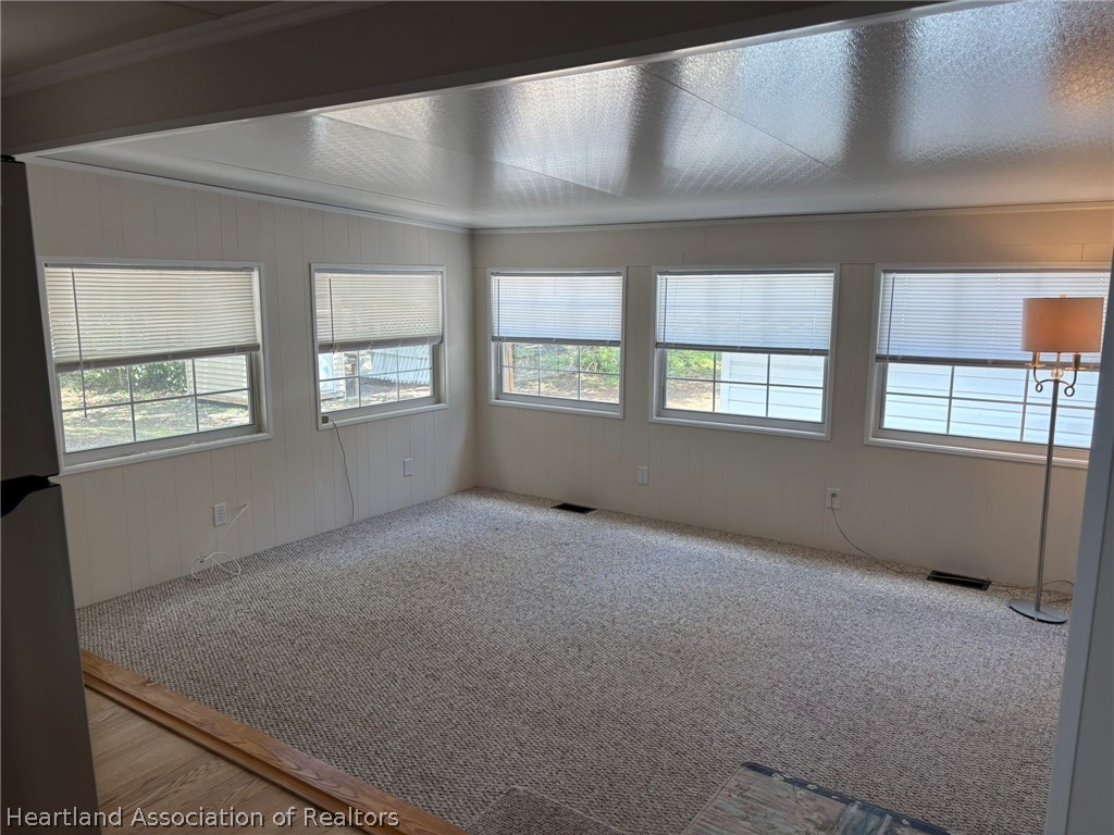 7938 Elliott Road Sebring, FL 33876 - Photo 8 of 20 an empty room with windows