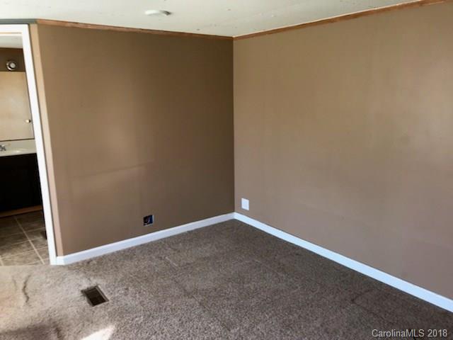 130 Branton Farm Road, Unit 6 Stony Point, NC 28678 - Photo 3 of 7 an empty room with windows