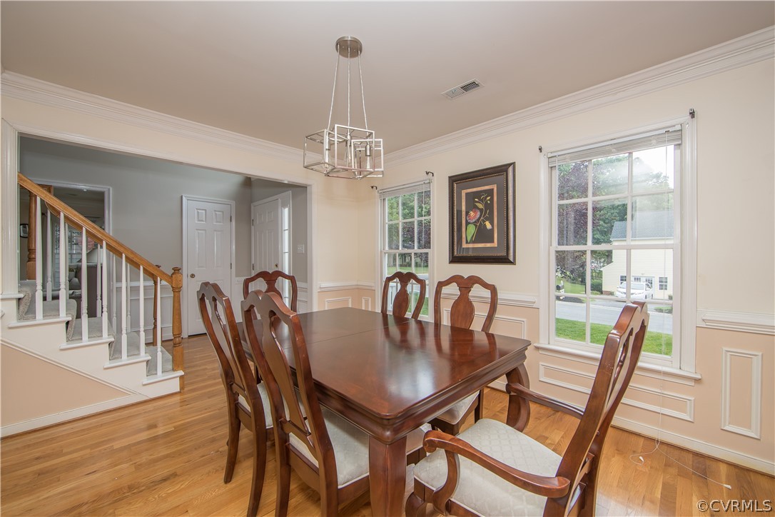 15213 Windy Ridge Road Midlothian, VA 23112 - Photo 12 of 30 a view of a dining room with furniture window and wooden floor