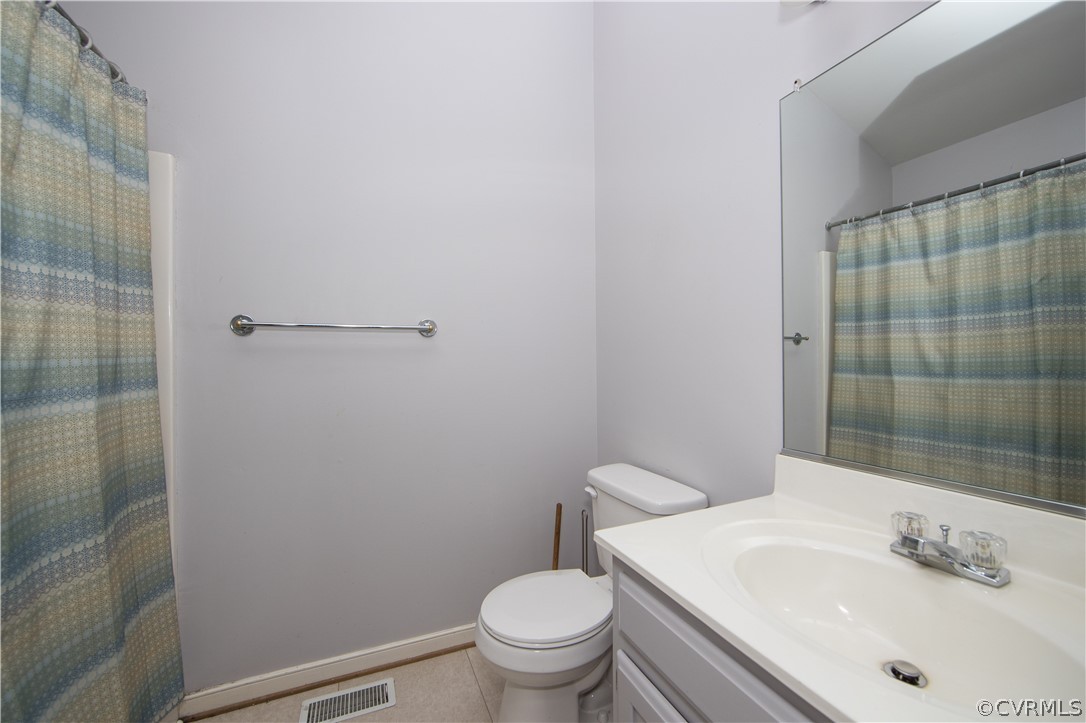 15213 Windy Ridge Road Midlothian, VA 23112 - Photo 27 of 30 a bathroom with a sink toilet and shower