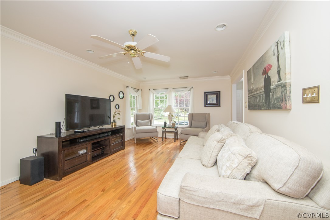 15213 Windy Ridge Road Midlothian, VA 23112 - Photo 6 of 30 a living room with furniture and a flat screen tv