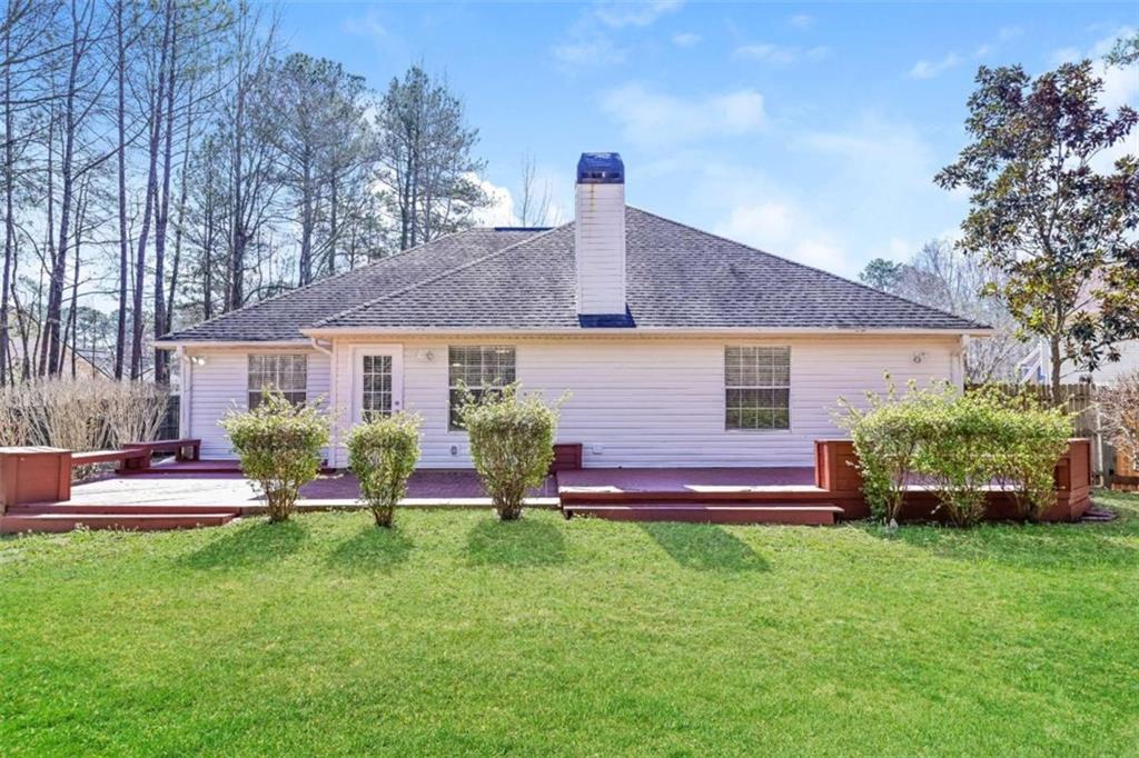106 Emerald Lane Hampton, GA 30228 - Photo 2 of 19 a front view of house with yard and outdoor seating