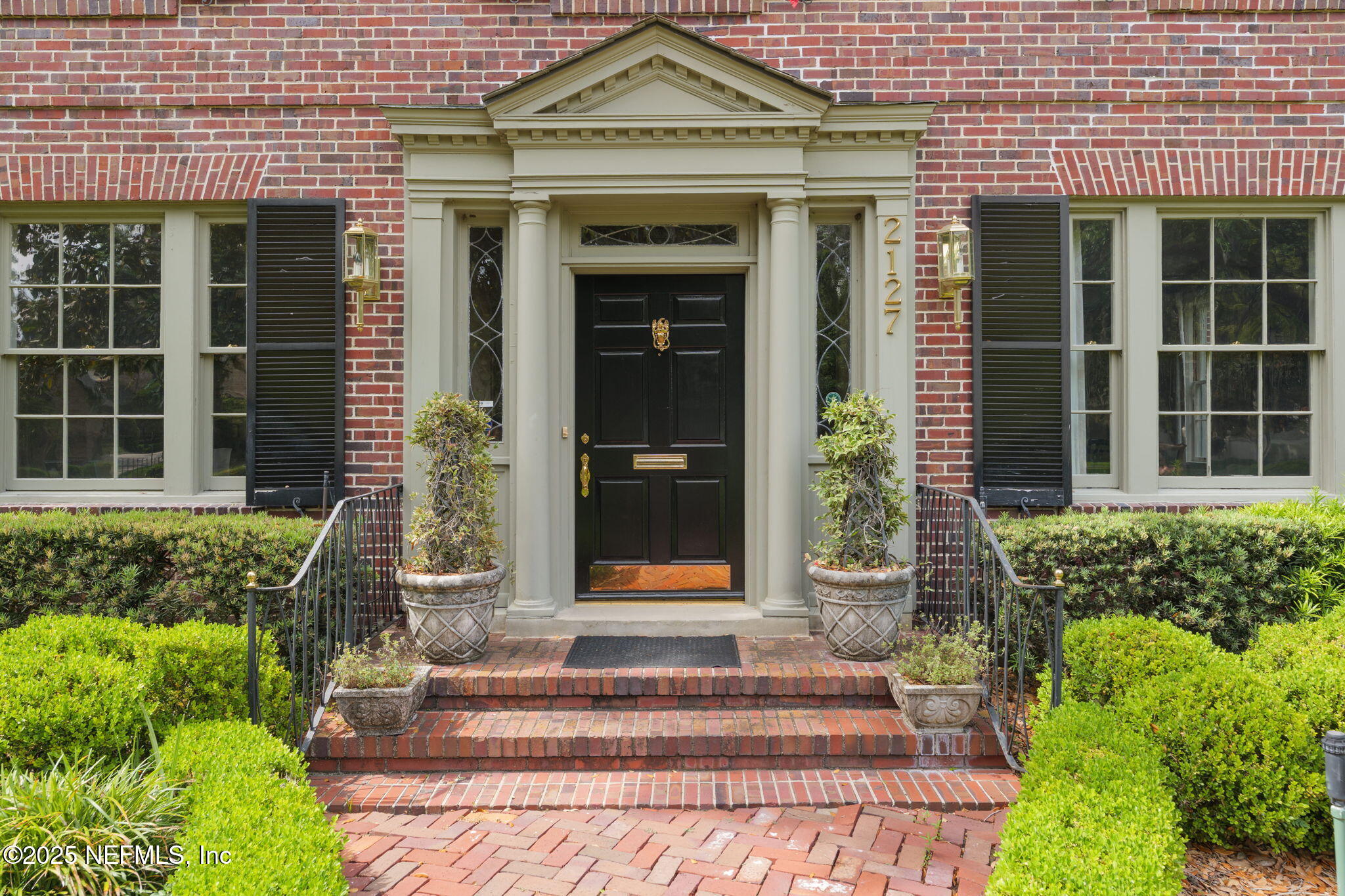 2127 River Road Jacksonville, FL 32207 - Photo 15 of 54 a front view of a house with a yard