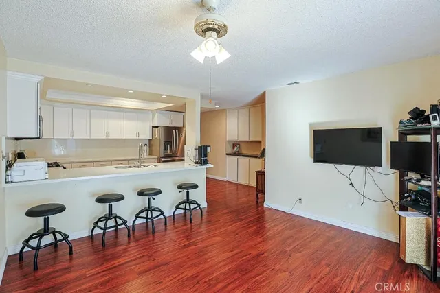 a view of a dining room with furniture and wooden floor