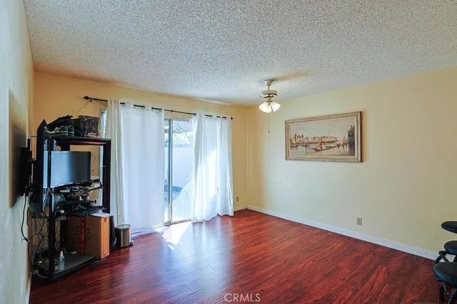 a view of a room with wooden floor and closet
