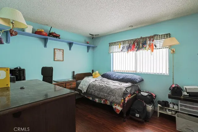 a bedroom with bed and a window