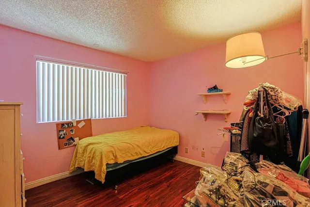 a bedroom with a bed and a closet