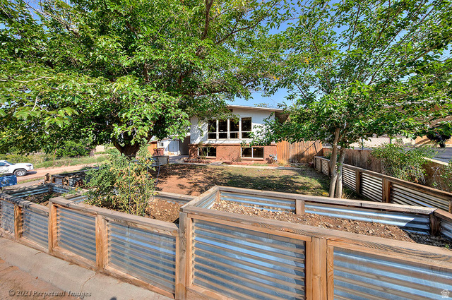 615 East Rose Tree Lane Moab, UT 84532 - Photo 6 of 40 View of front of property featuring raised garden beds.