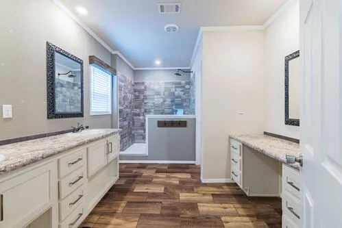 an empty room with closet and a chandelier fan