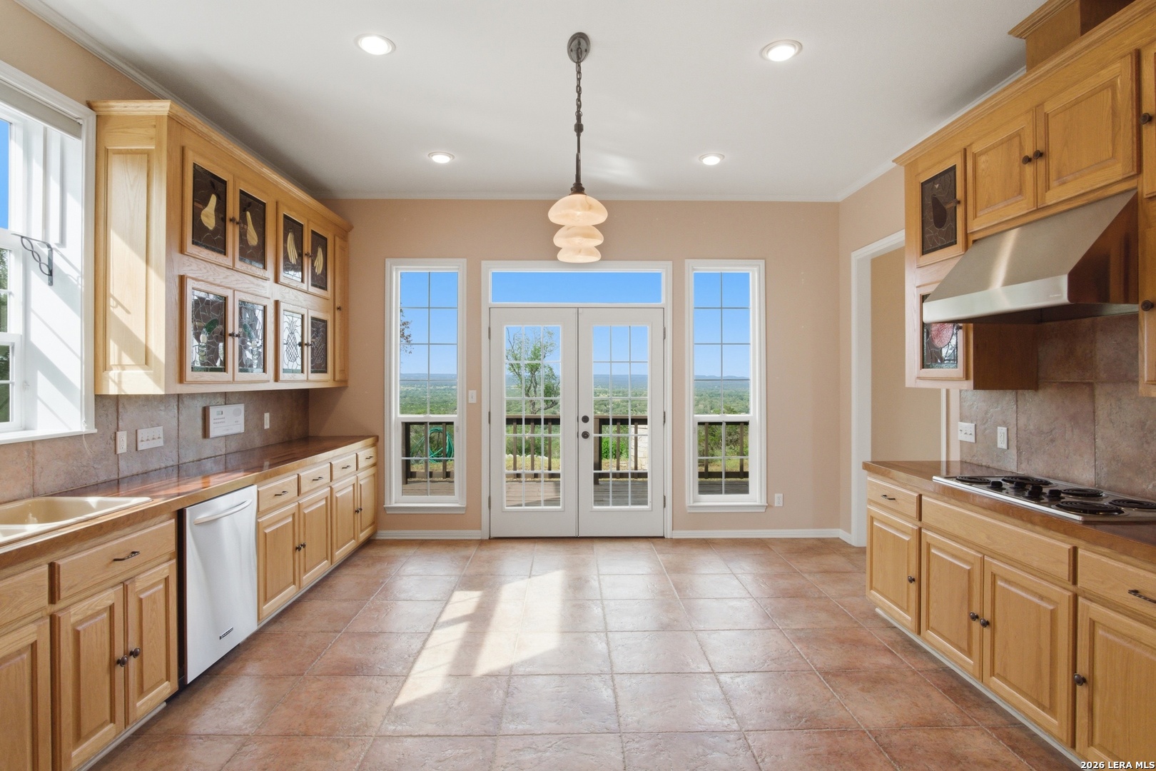 26 Seewald Road Boerne, TX 78006 - Photo 7 of 33 a large kitchen with stainless steel appliances granite countertop a stove and large cabinets